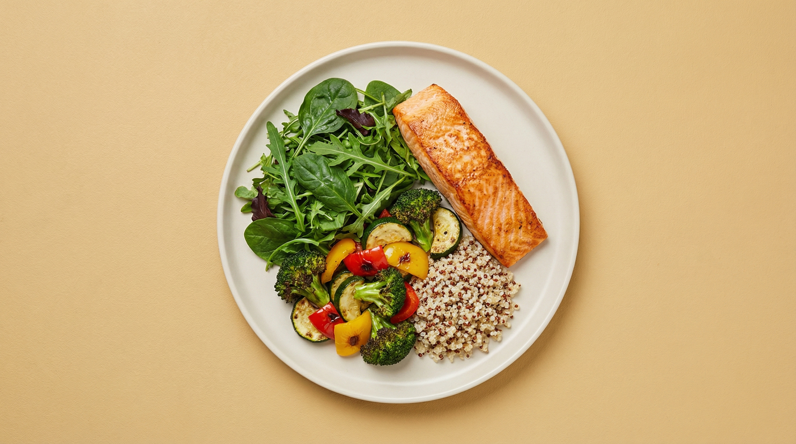 Prediabetes-friendly balanced meal overhead — grilled salmon, leafy greens, and roasted vegetables on a light plate
