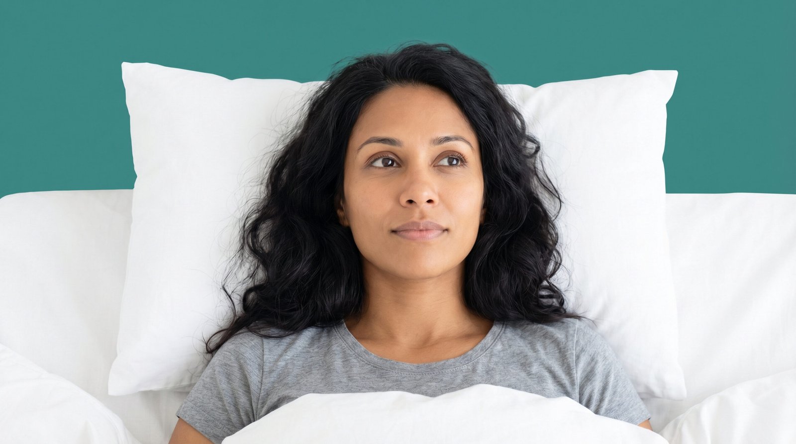 sleep and insulin resistance — woman lying awake at night, dim bedroom