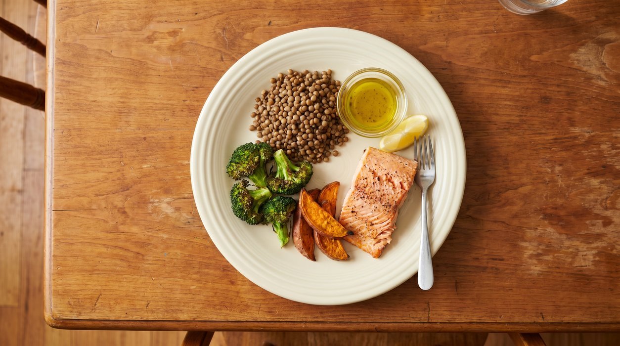 balanced plate with salmon lentils roasted broccoli and sweet potato